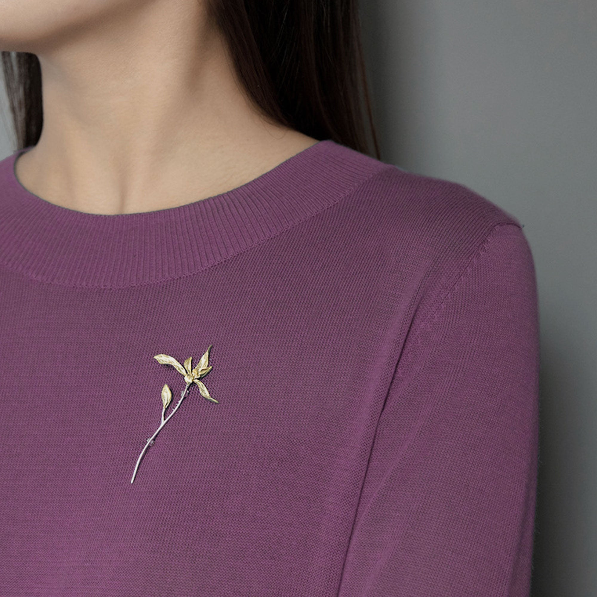 Close-up of orchid flower brooch showing petal texture