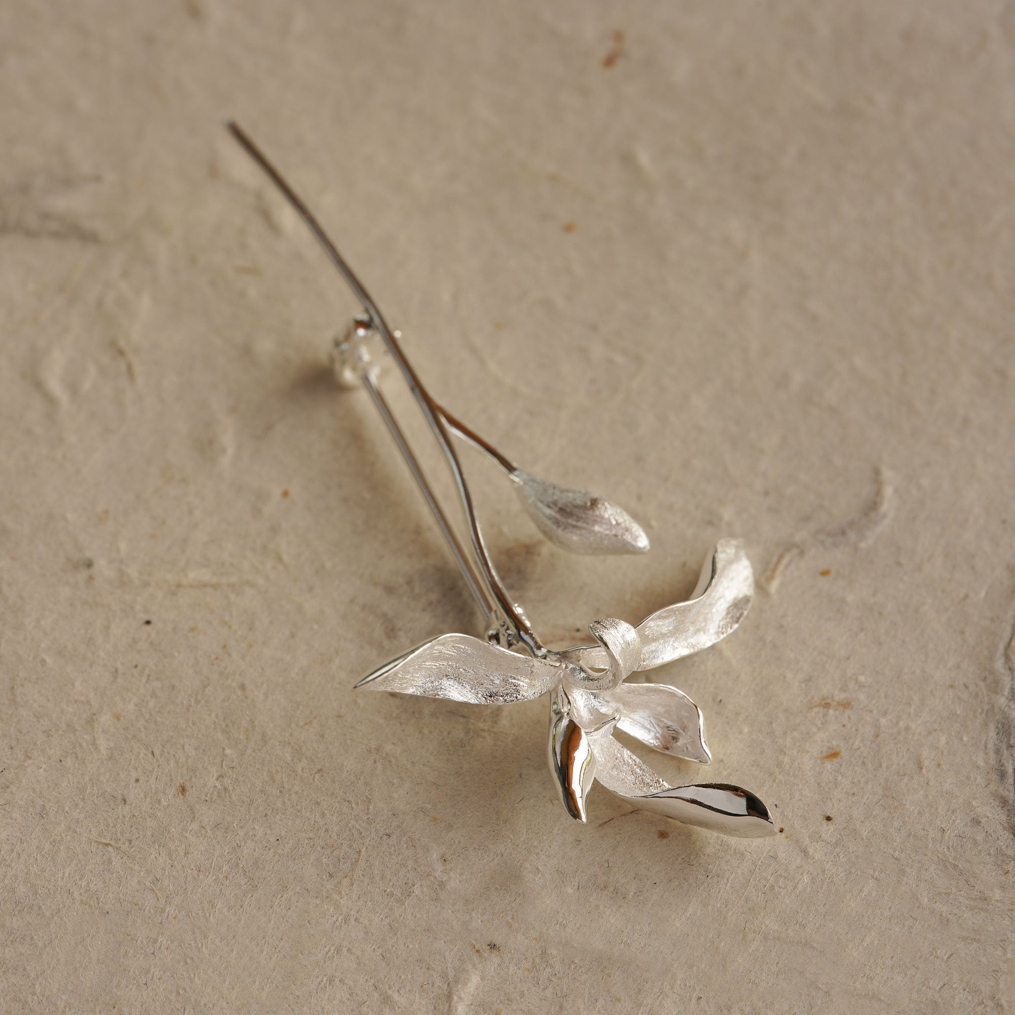 Orchid flower brooch styled for clothing or scarf