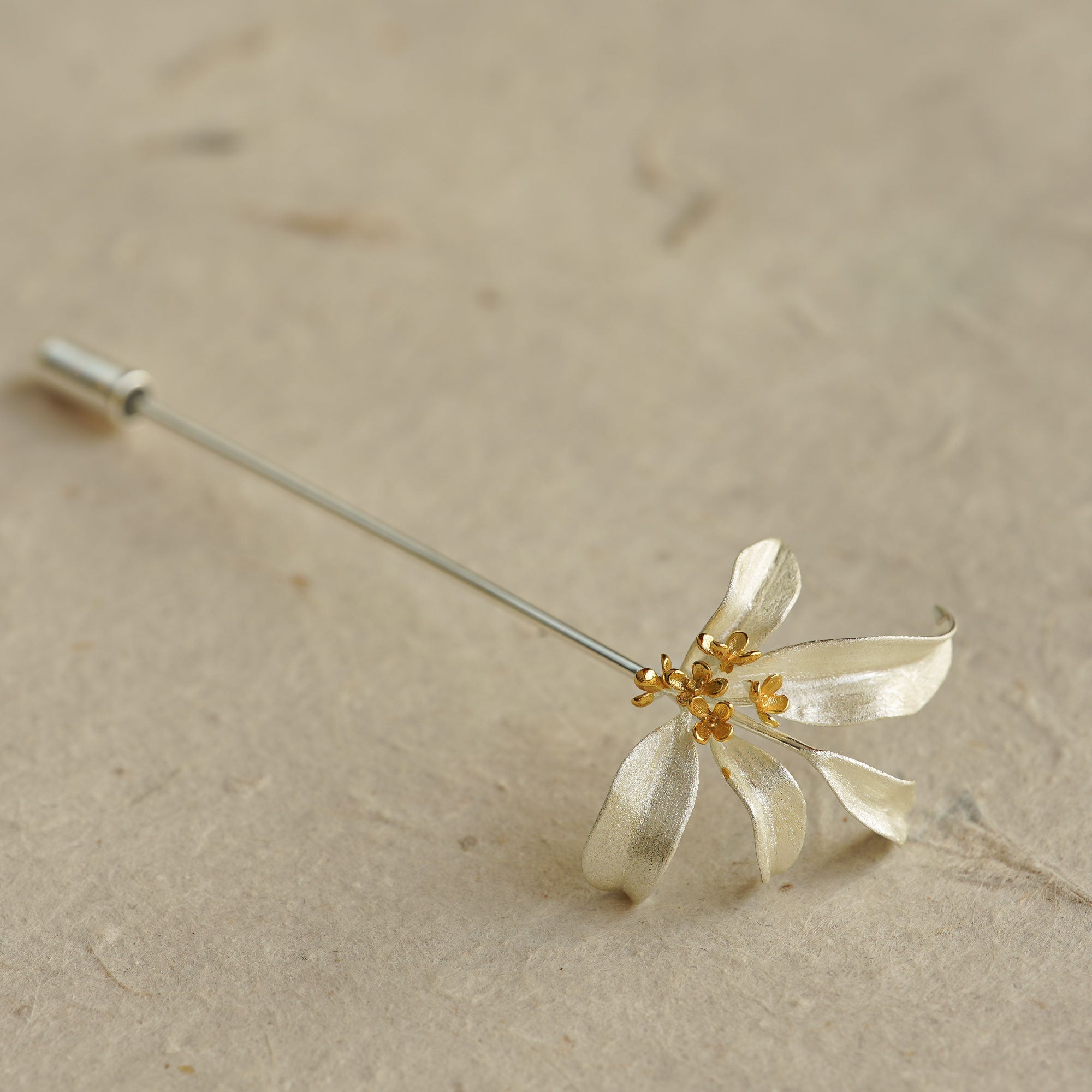 Osmanthus brooch showing handmade floral details