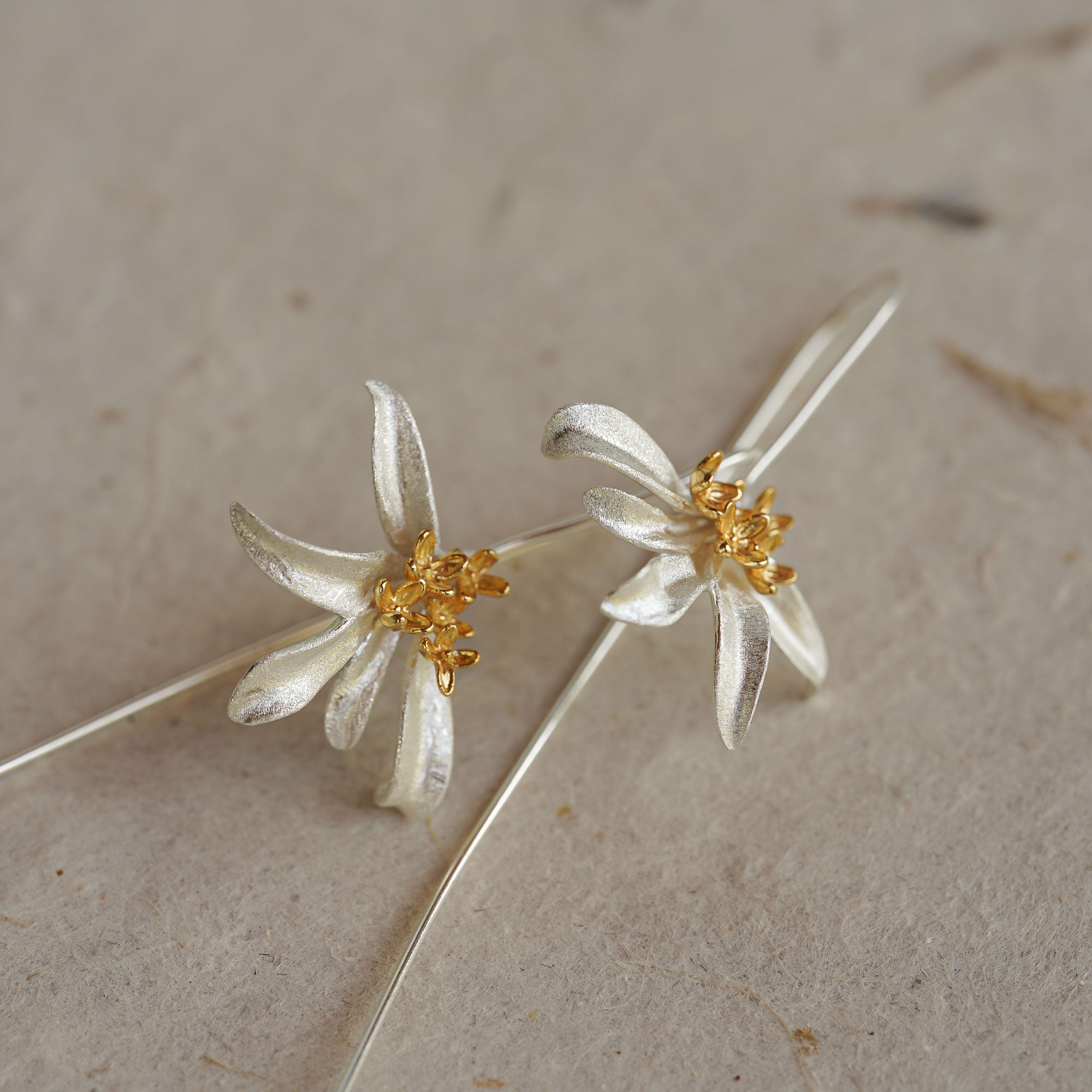Osmanthus drop earrings showing flower details