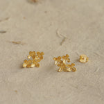 Osmanthus earrings styled as botanical jewelry