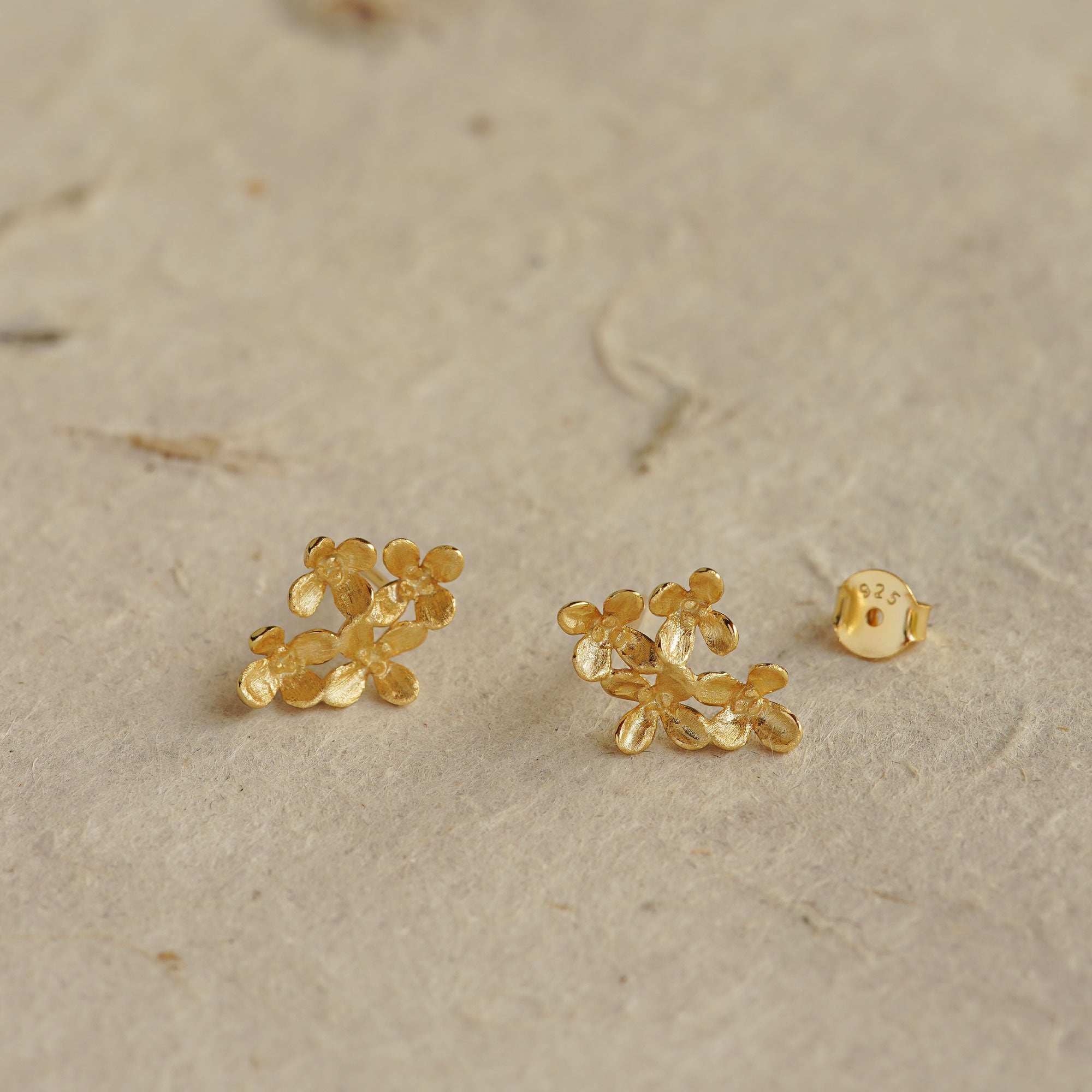 Osmanthus earrings styled as botanical jewelry