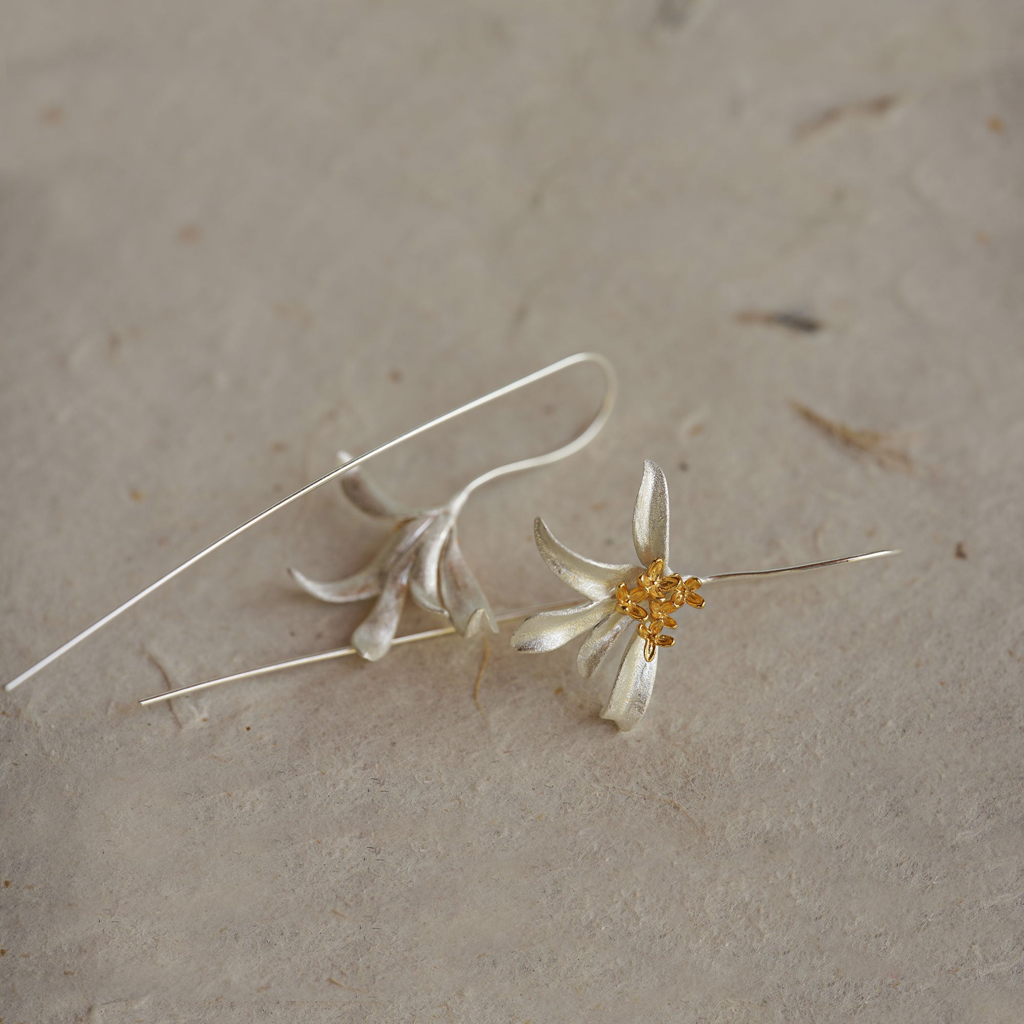Close-up of osmanthus flower earrings