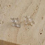 Osmanthus flower earrings showing handmade details