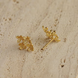 Osmanthus flower earrings displayed as a pair