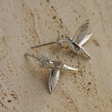 Pair of hummingbird earrings displayed together