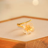 Pear blossom ring in floral jewelry display
