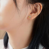 Pear flower earrings displayed as a pair