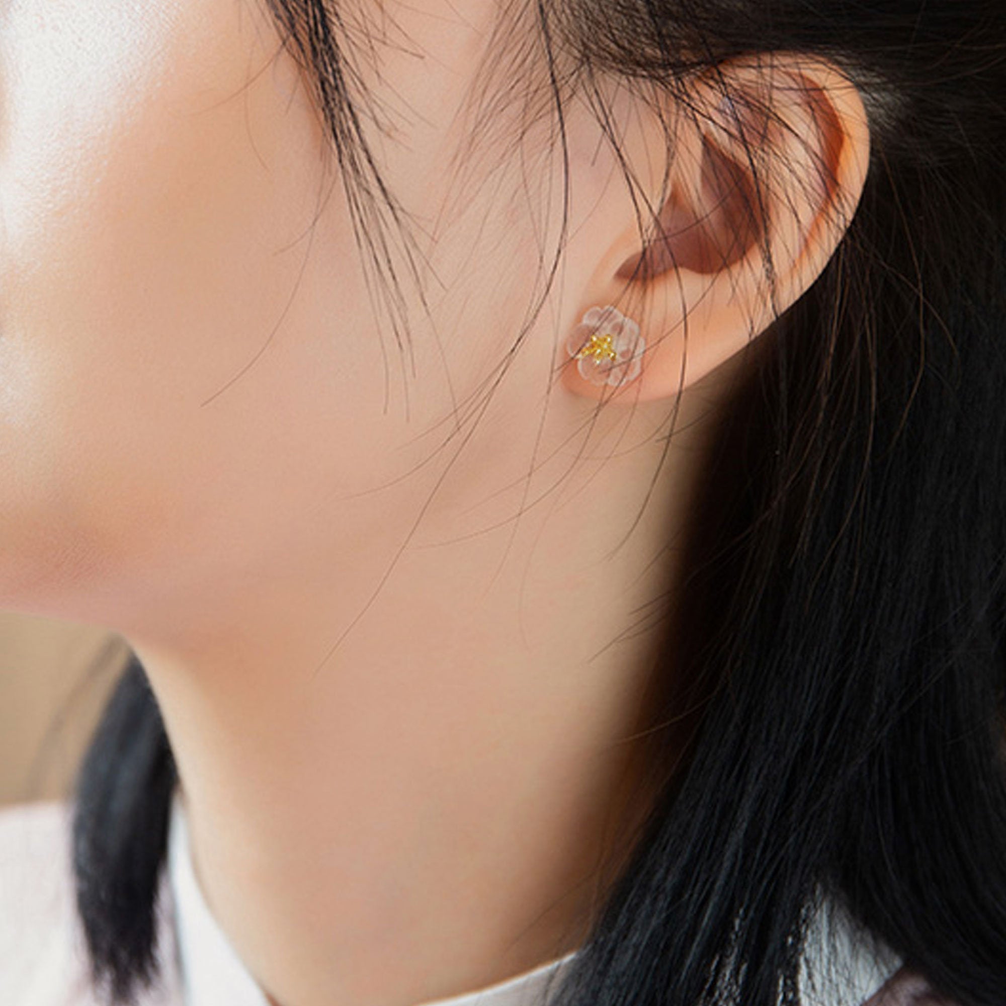 Pear flower earrings displayed as a pair