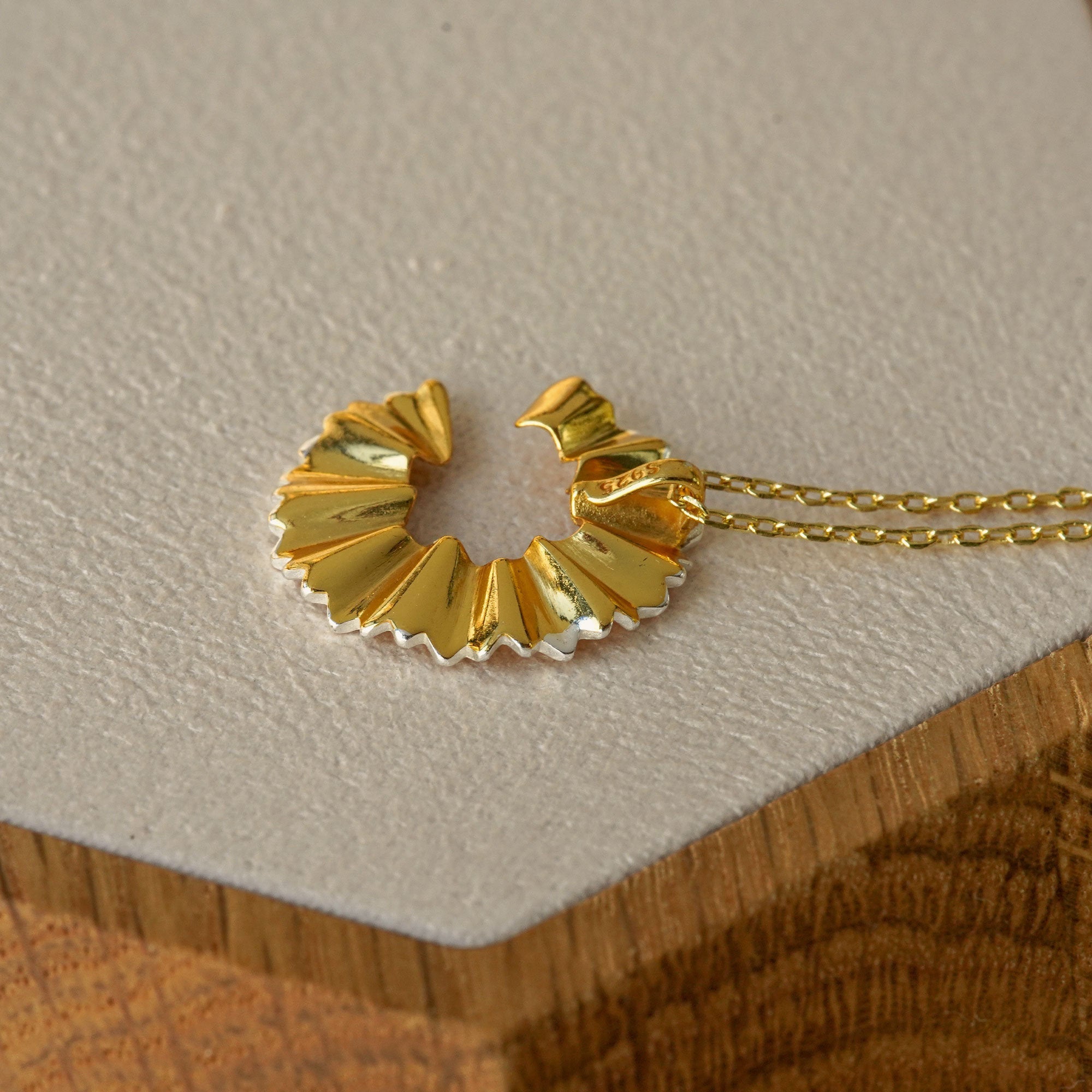 Pencil pendant necklace showing chain detail