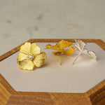 Peony earrings styled as botanical jewelry