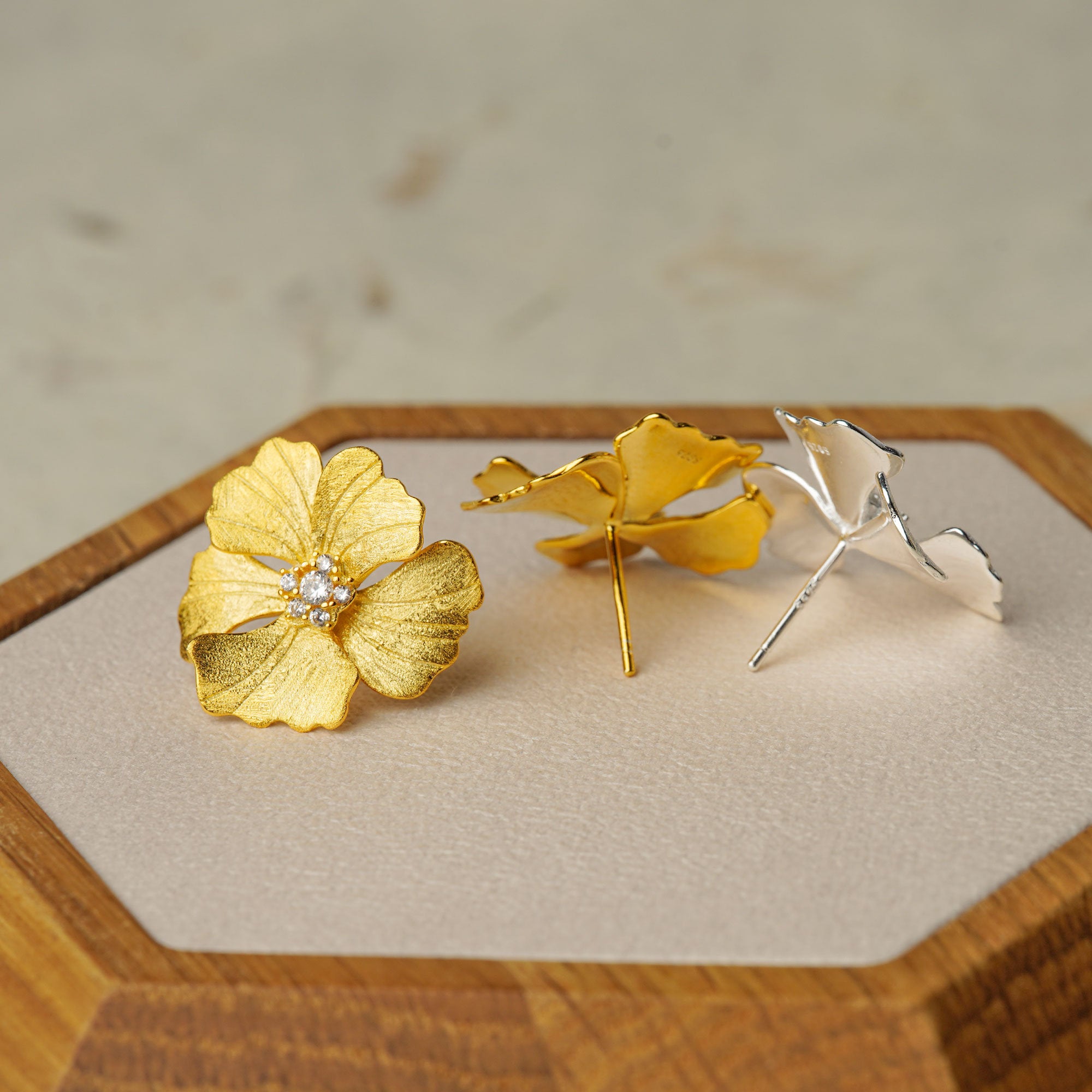 Peony earrings styled as botanical jewelry