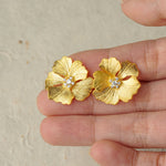 Close-up of peony earrings showing flower details