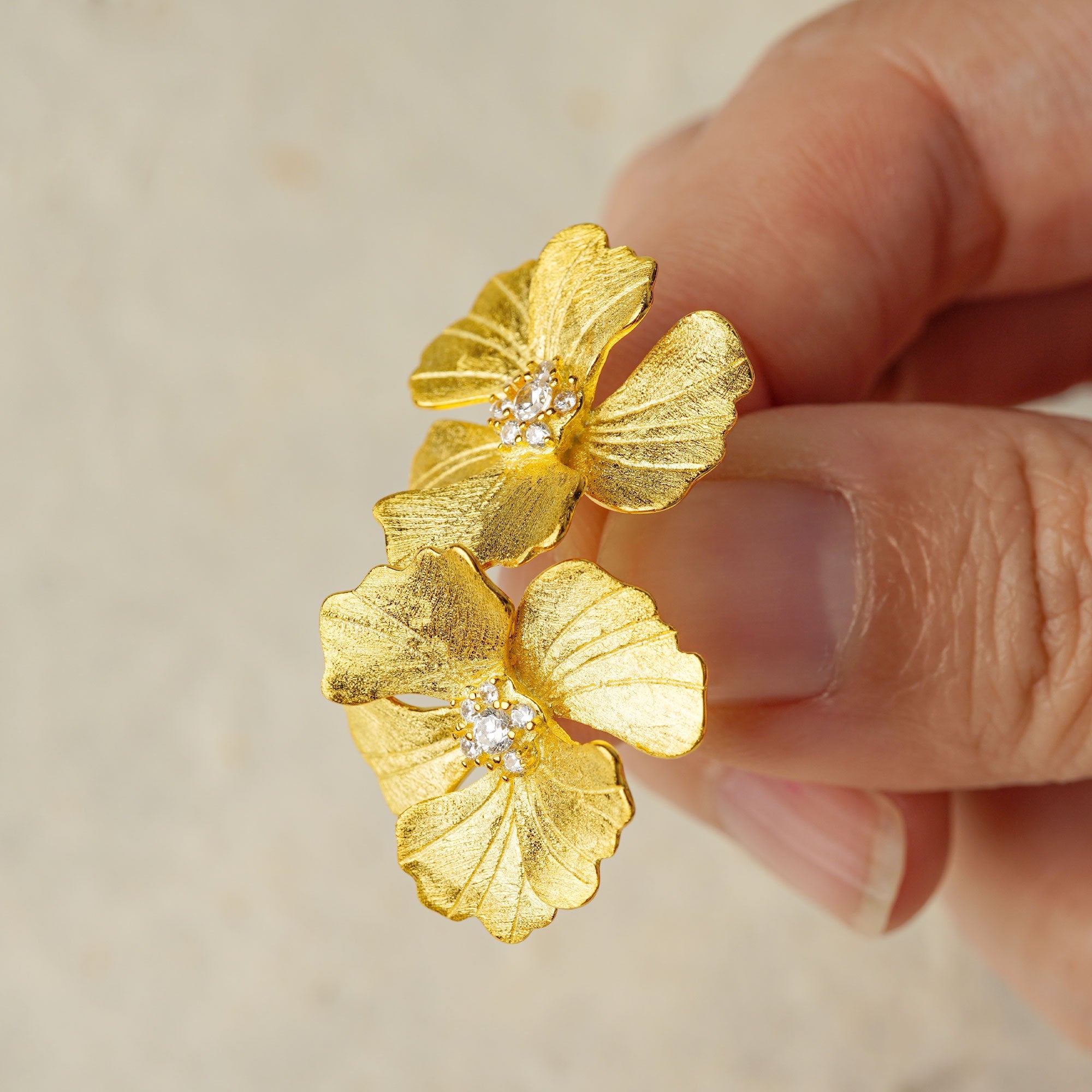 Peony flower earrings showing handmade details