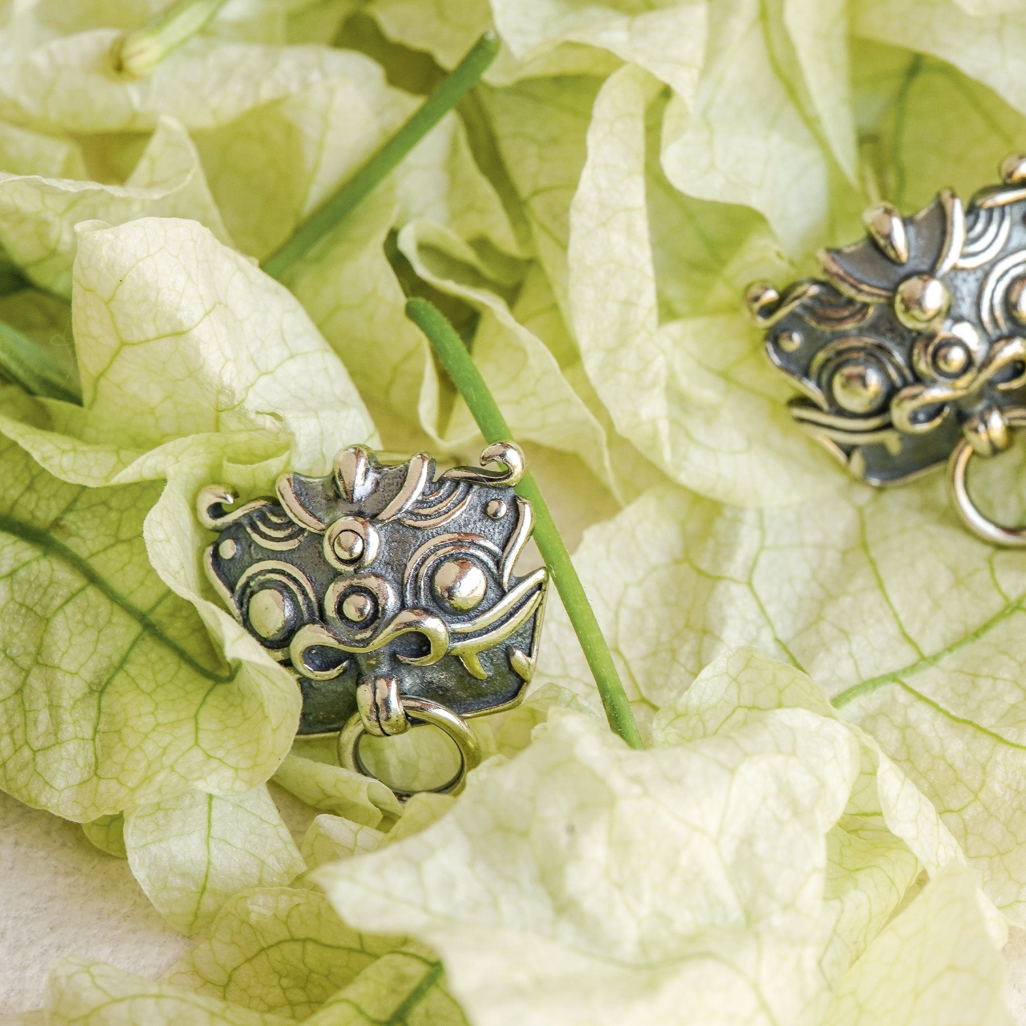 Pixiu earrings showing handmade jewelry details
