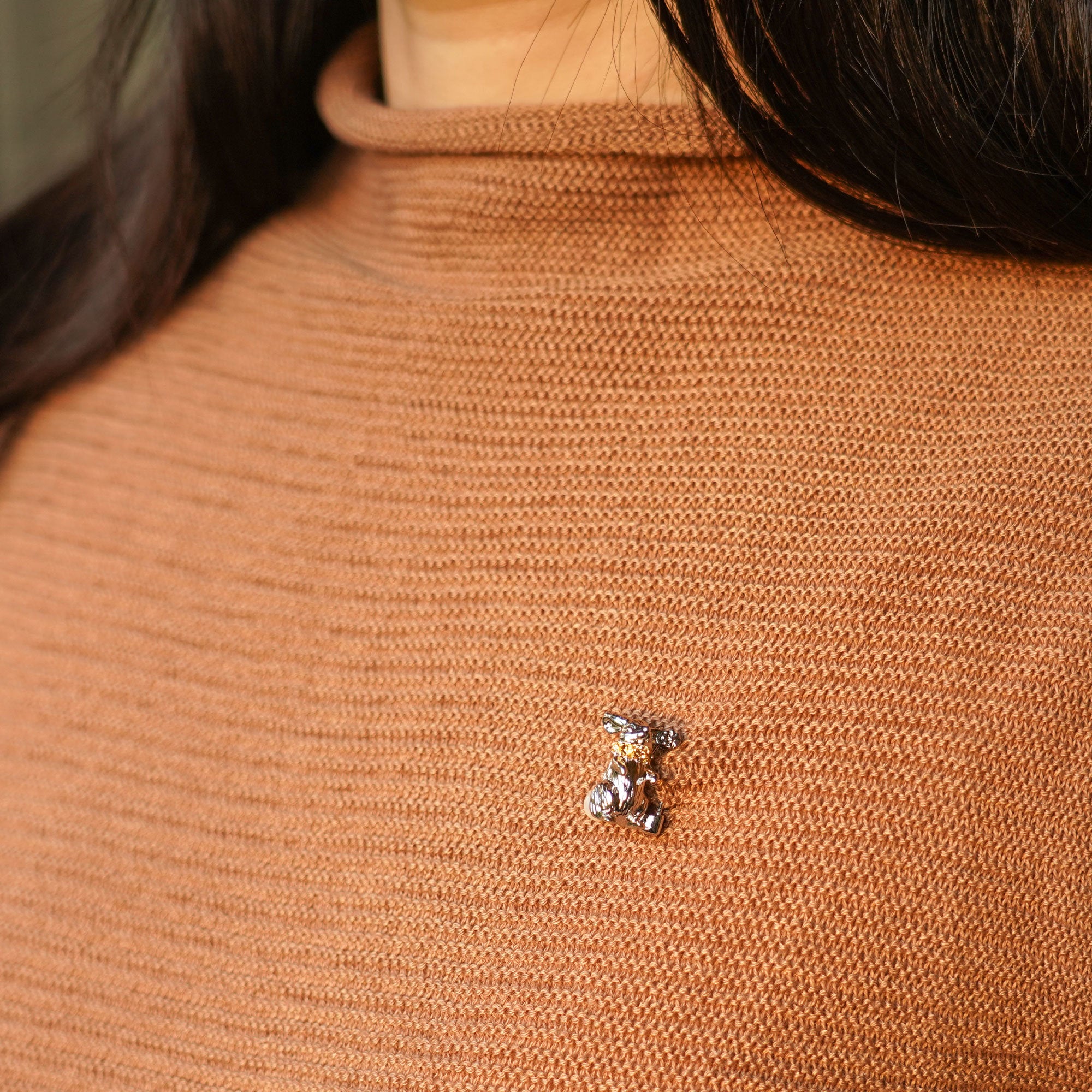 Rabbit pin showing handmade jewelry details