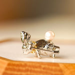 Side view of Alice rabbit brooch