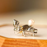 Side view of Alice rabbit brooch