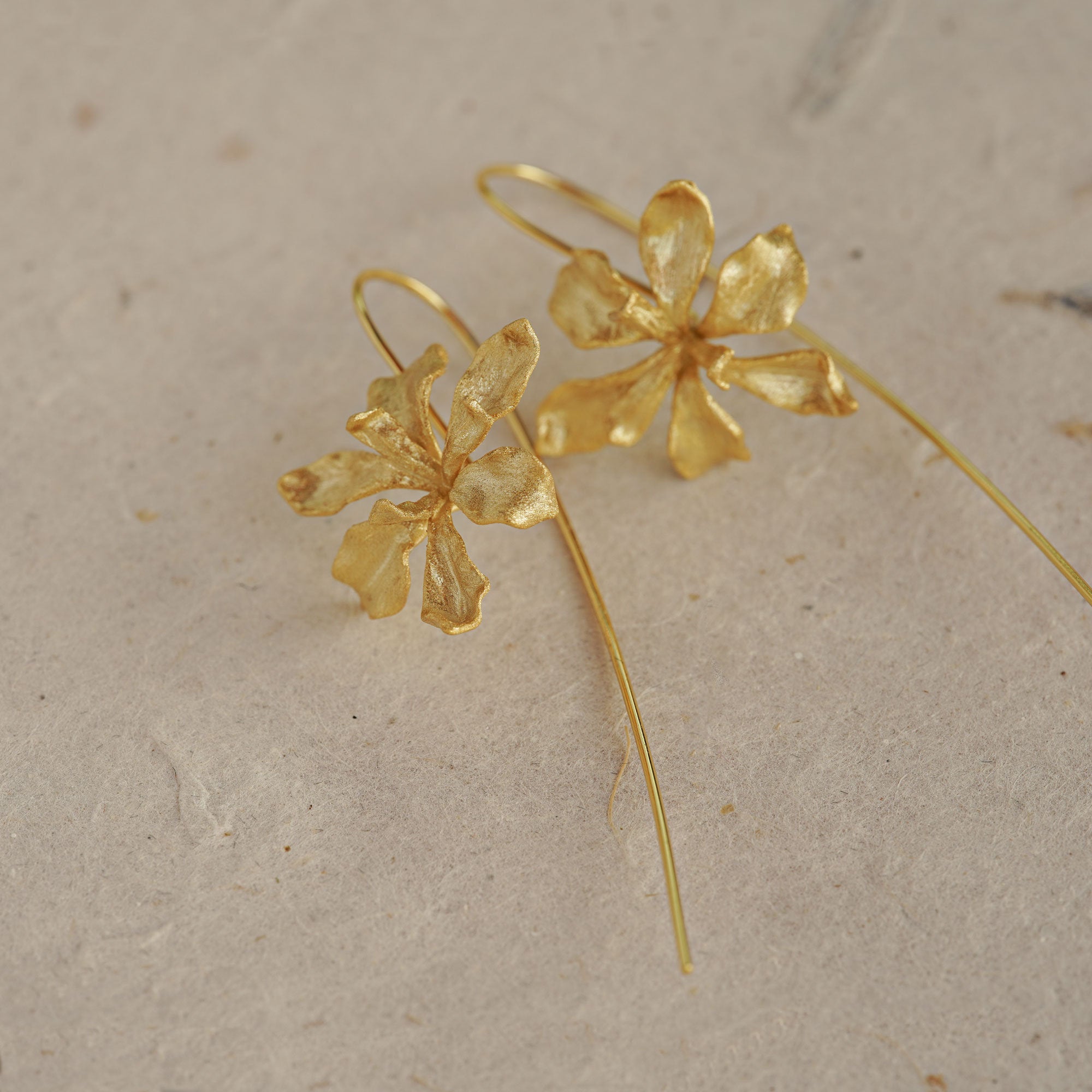 Side view of iris flower drop earrings
