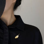 Side view of leaf brooch