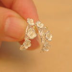 Side view of plum blossom flower earrings