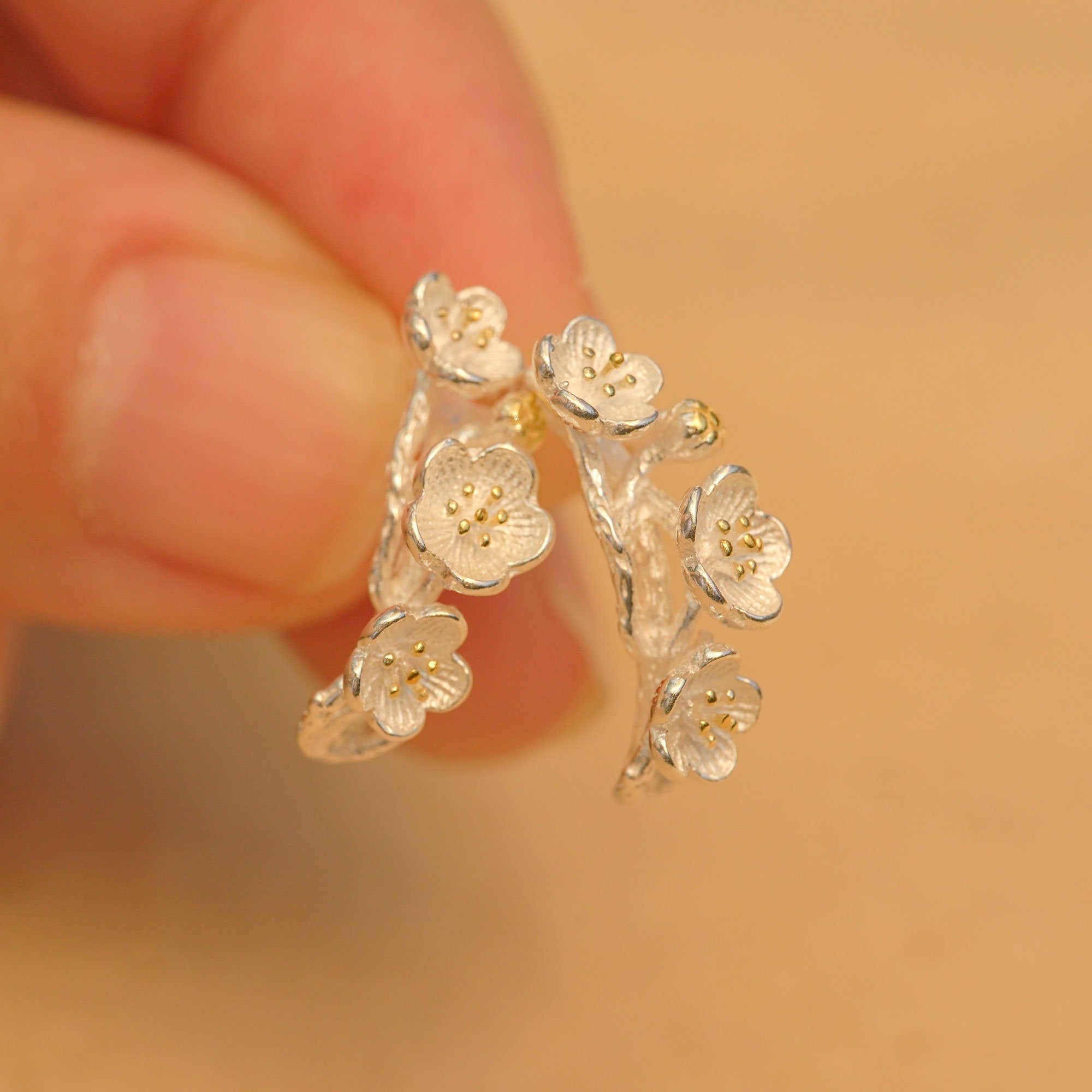 Side view of plum blossom flower earrings