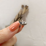 Side view of sphinx cat earrings