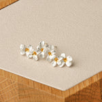 Pair of silver floral earrings for everyday wear
