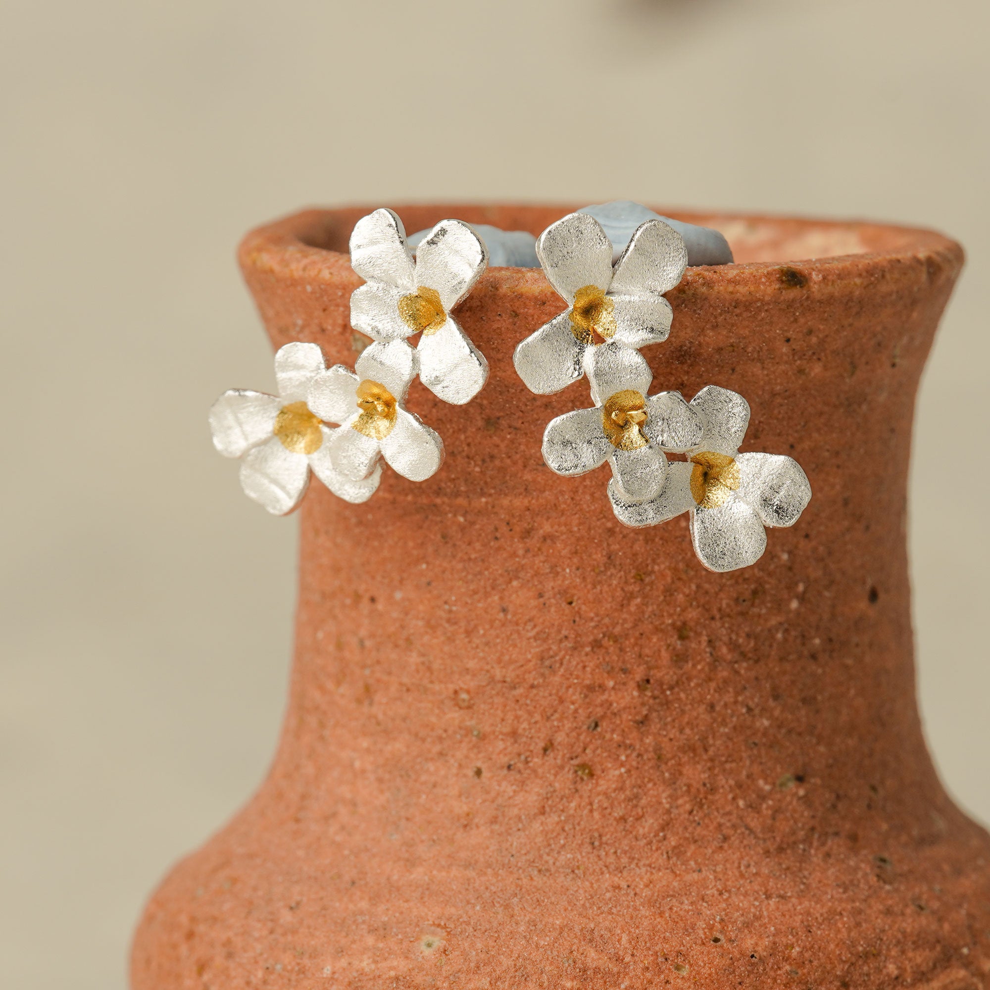 Silver flower earrings with delicate floral design