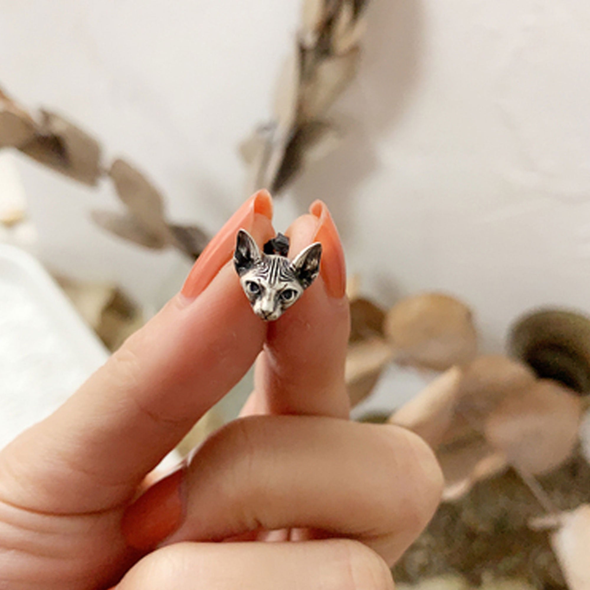 Sphinx cat earrings with animal inspired design
