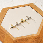 Tiny hummingbird earrings styled as bird jewelry
