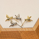 Tiny hummingbird stud earrings with bird silhouette